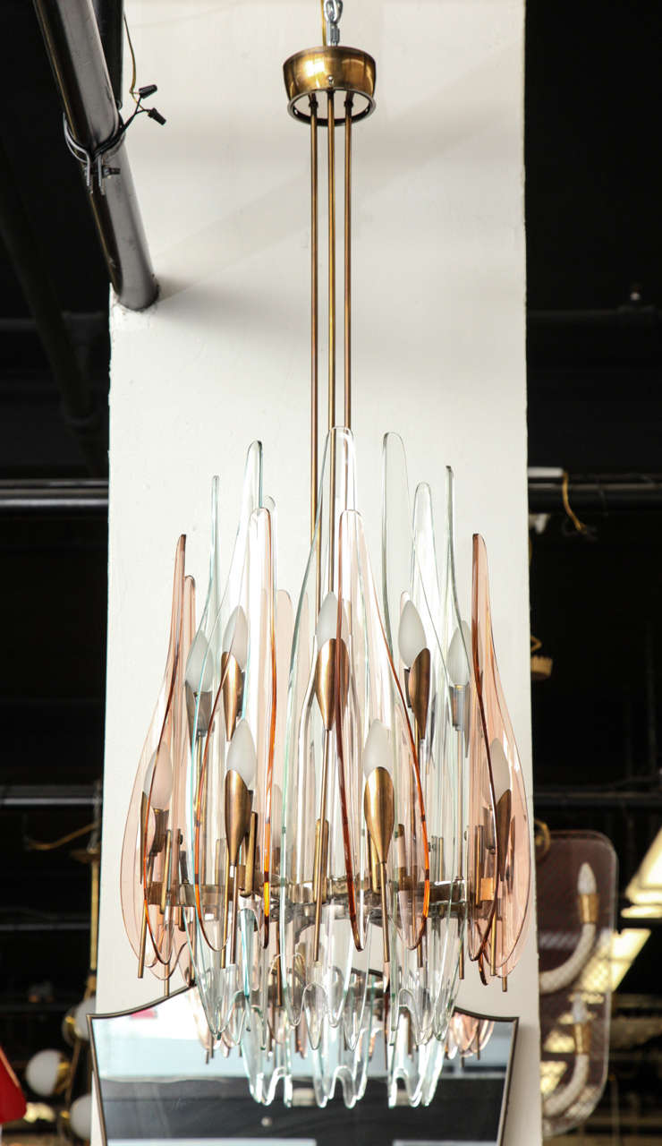 Stunning sixteen-light dahlia chandelier designed by Max Ingrand, made in Milan, 1954 by Fontana Arte. 16 alternating rose and aqua shades arranged vertically in curved and cut-glass on a nickel on bronze frame, great quality. Truly one of the most
