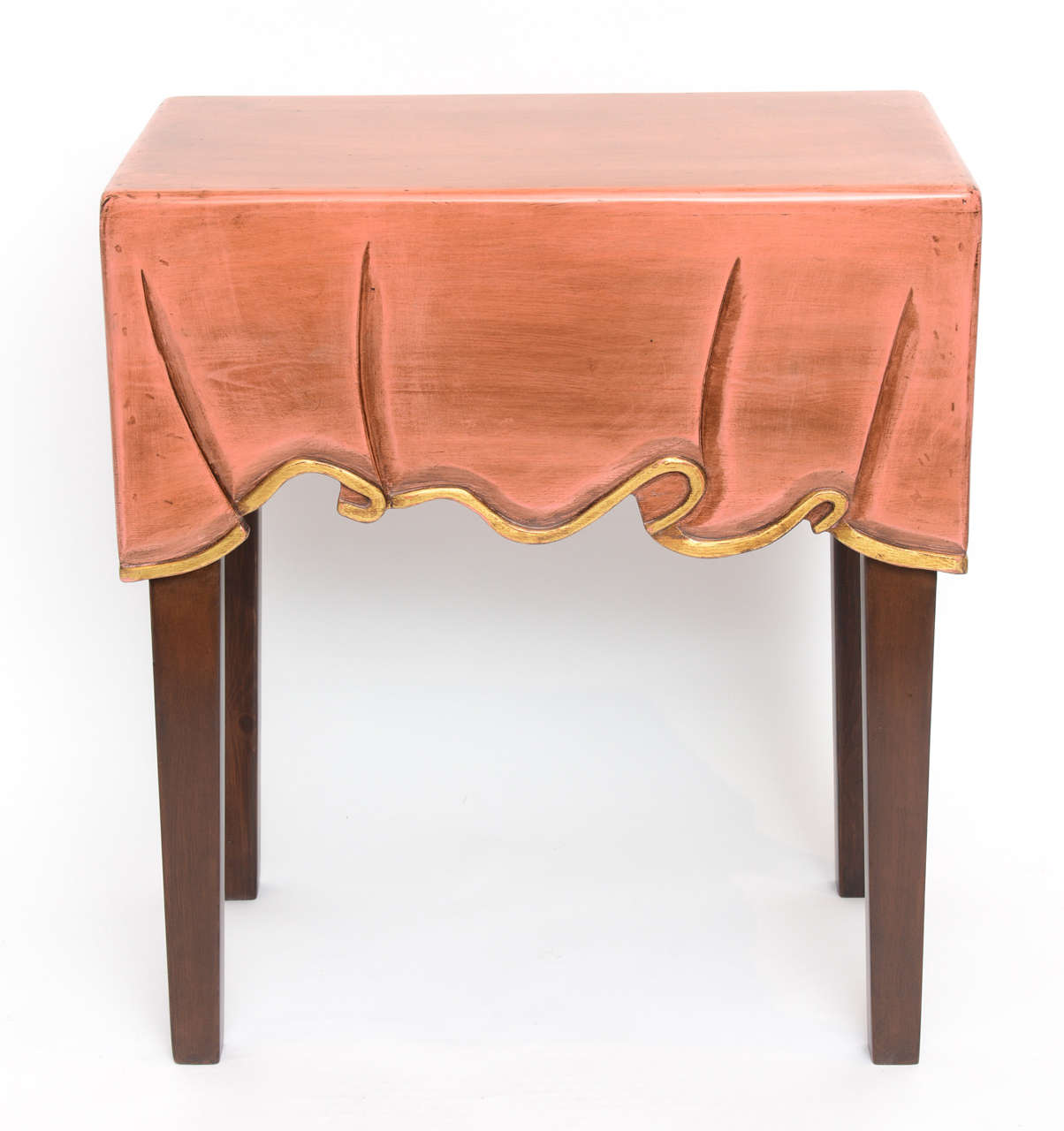 All carved from one piece of wood in antiqued pink and brown tones with soft gold leaf details.