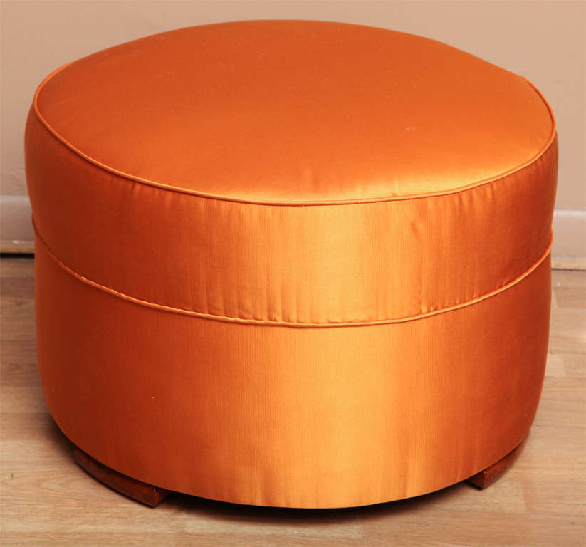 Attractive Art Deco pouf upholstered in Hermes orange silk/cotton Veraseta fabric. Original wood feet.