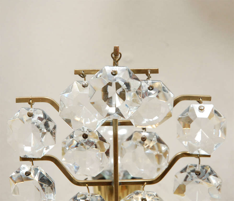 Glamorous pair of Italian crystal sconces. Multiple rows of dangling crystal 