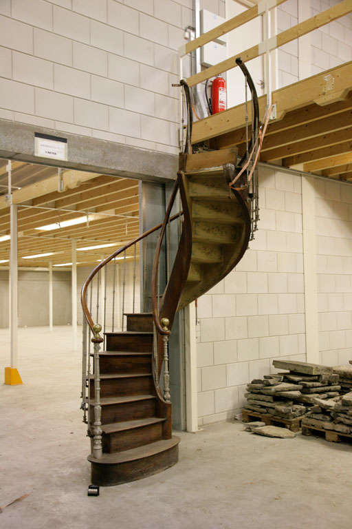 An antique walnut spiral staircase.
H 300 cm x W 66 cm x 20 cm height per step, total 15 steps.