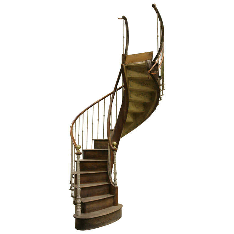 An antique walnut spiral staircase