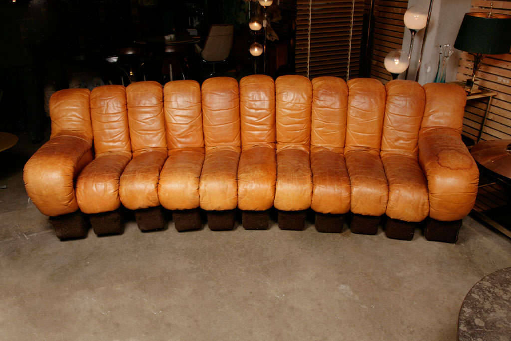 Wonderful 11 elements De Sede ds-600 sofa by the De Sede design team Ueli Berger, Elenora Peduzzi-Riva, Heinz Ulrich and Klaus Vogt. The color is cognac brown -a rare color to find- There's a waterstain on the right armrest, in very good vintage