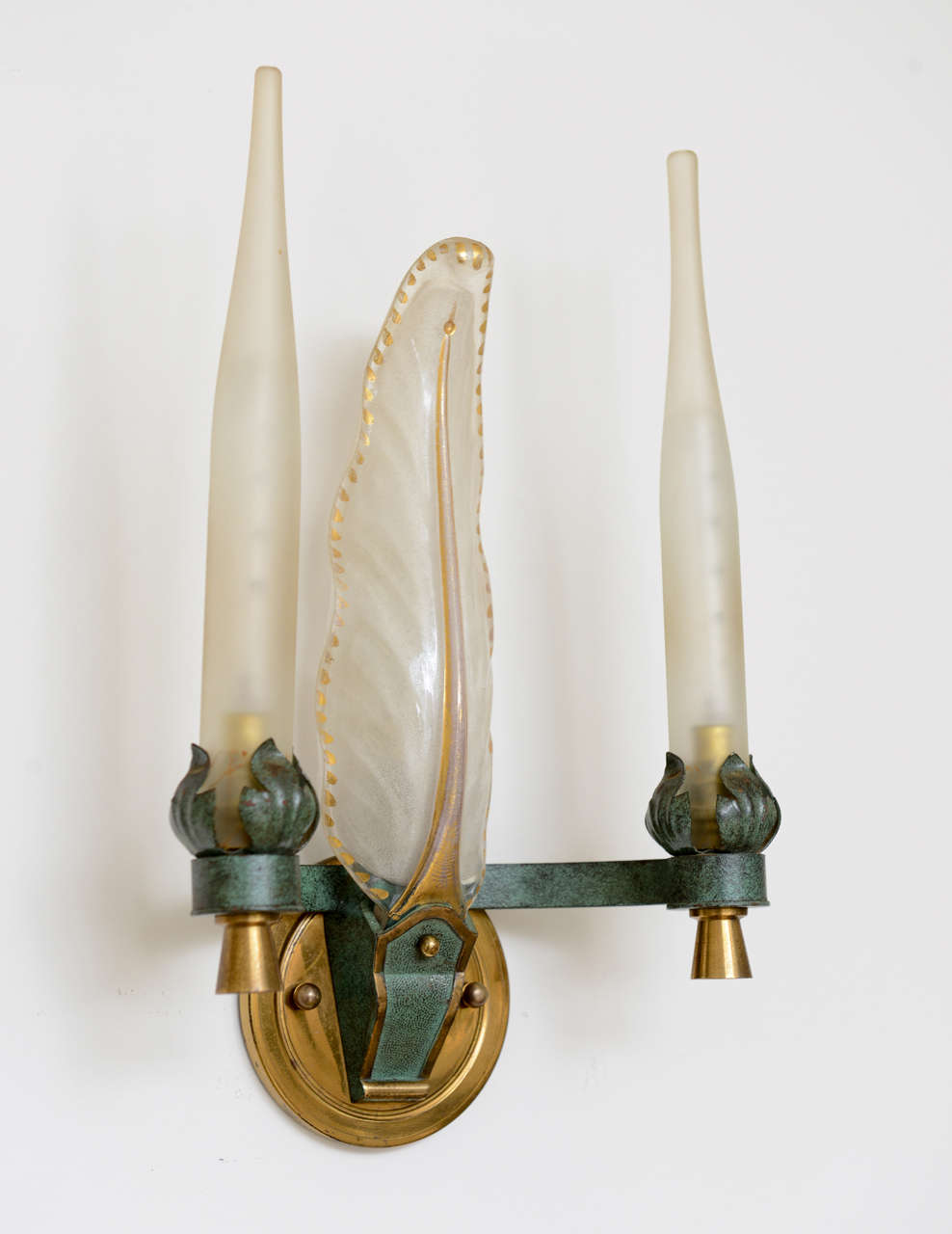 Beautiful pair of wired French wall sconces. Patinated verdigris and brass, handblown frosted glass candles and hand-painted center leaf.

Please feel free to contact us directly for a shipping quote or any additional information by clicking