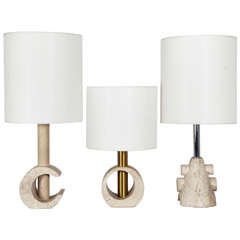 A Set Of Three Travertine And Metal Lamps