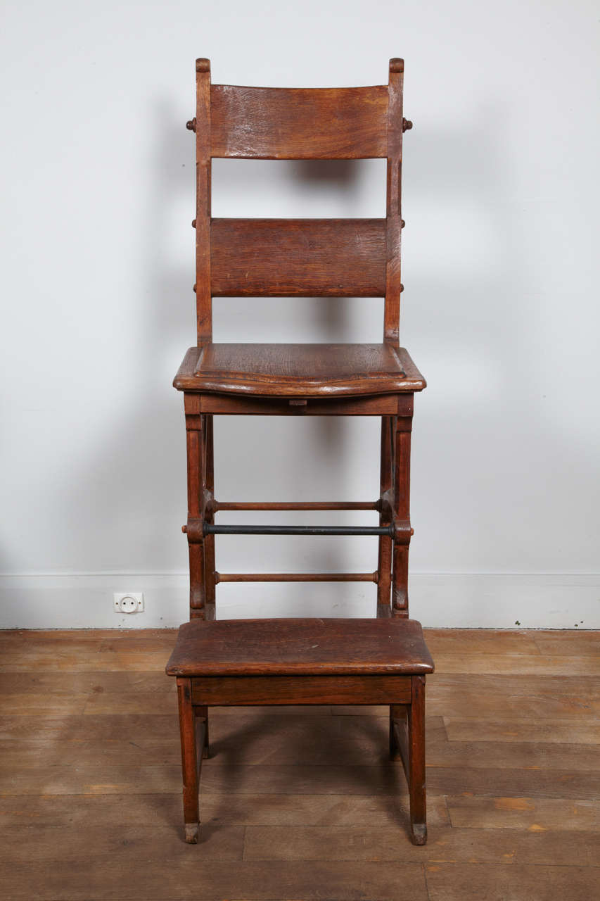 Library chair or stepladder in the taste of Pugin 
made in oak wood with a metal bar to be use as a step.
Great Britain, circa 1880.