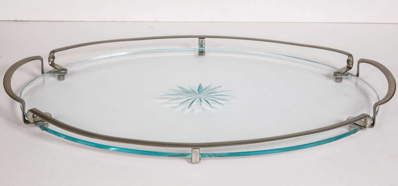 1950's Swedish substantial oval tray with centre etched multi-star. Surrounded by raised chrome handle and rim. Free standing as it sits on small raised chrome feet. Ideal for drinks, vanity or bathroom.