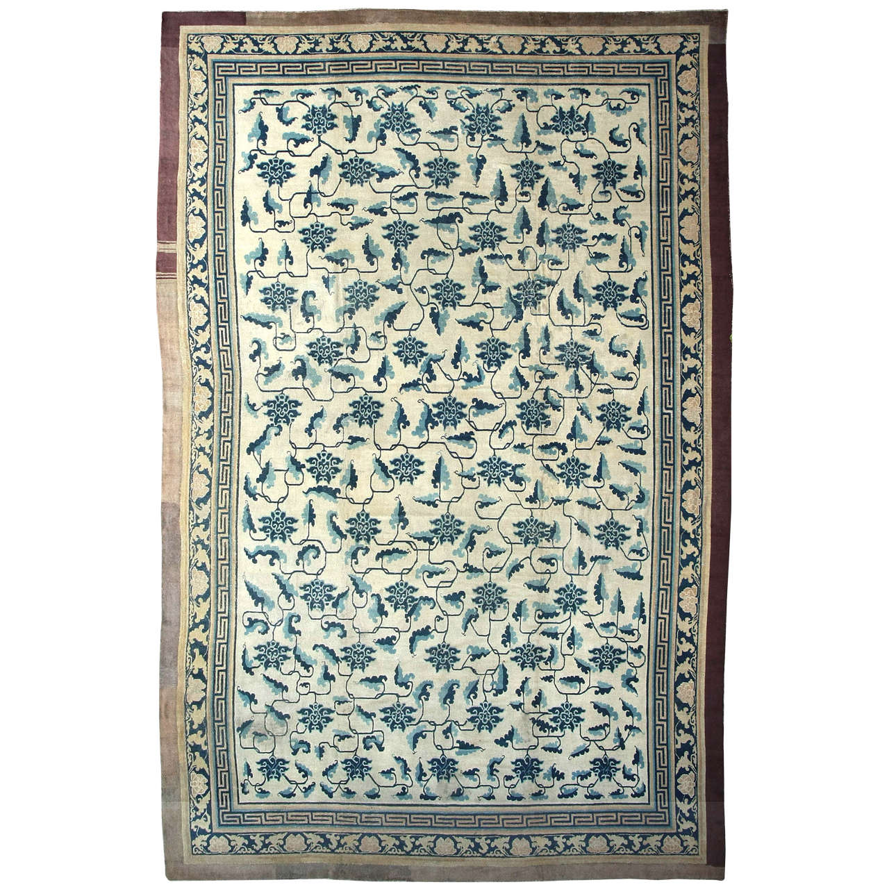 Early Chinese Carpet with Stylized Lotus Flowers and Leaf Stems