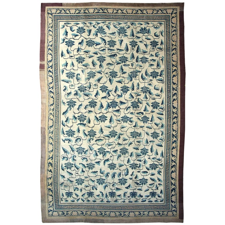 Early Chinese Carpet with Stylized Lotus Flowers and Leaf Stems For Sale