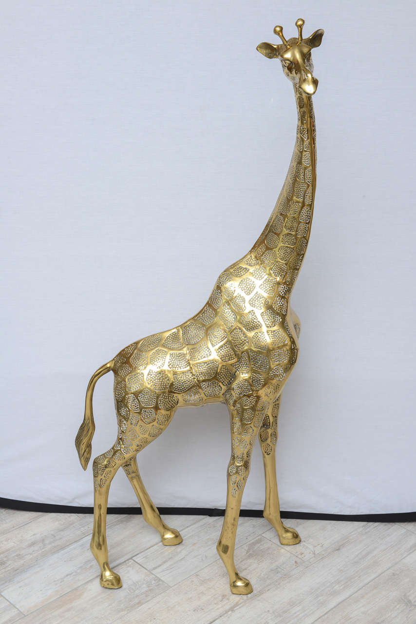 Unusual and whimsical brass giraffe sculpture.