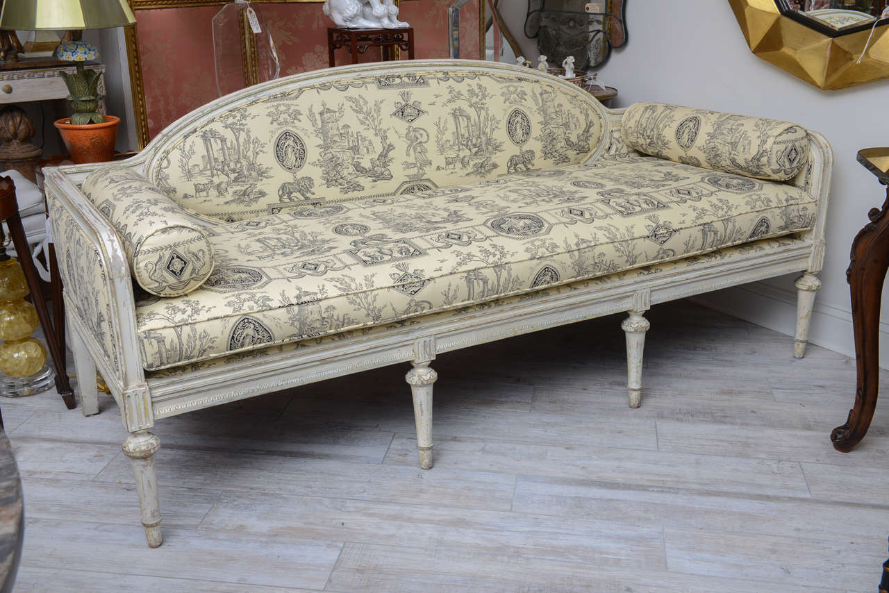 Elegant French Directoire period sofa in the Louis XVI style with newly upholstered cream and black toile fabric.