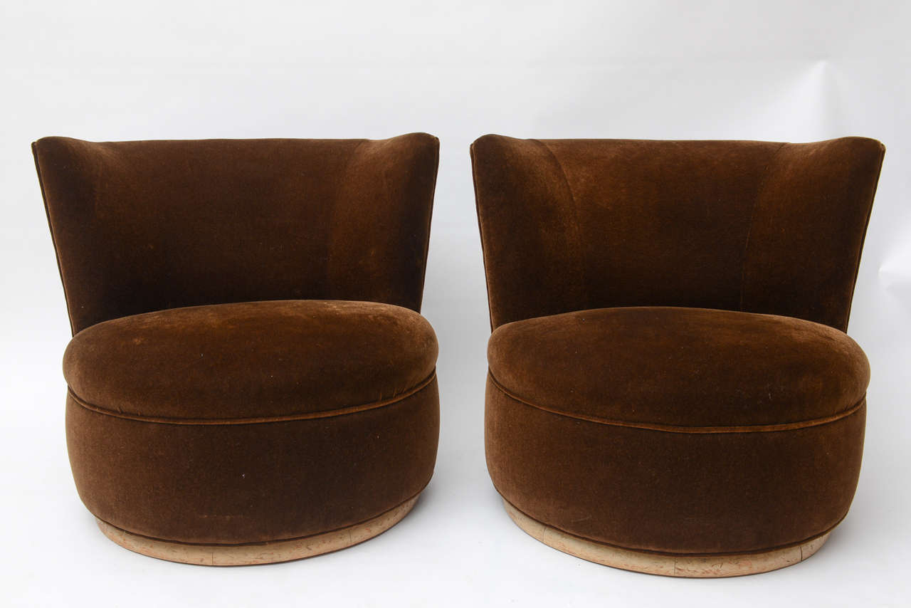 A large and comfortable pair of swivel chairs.