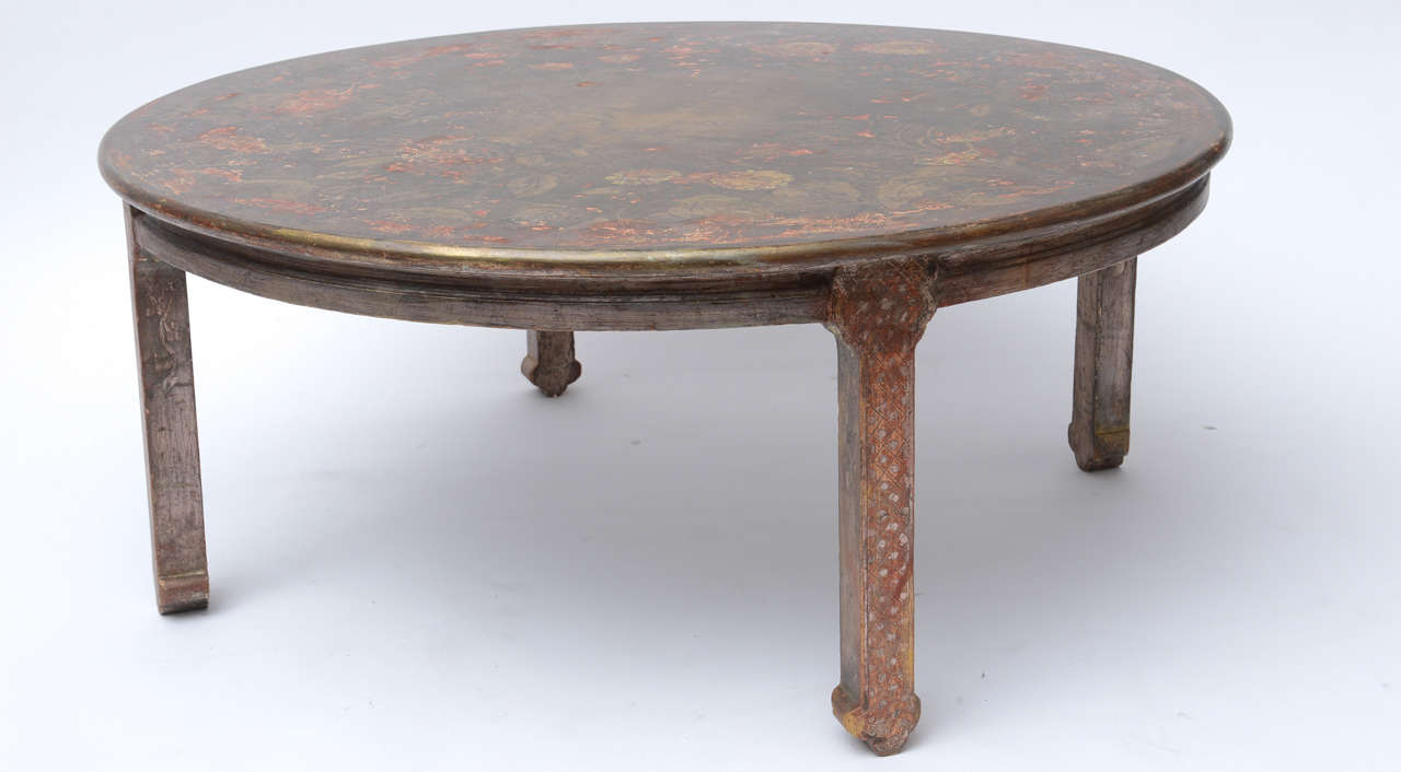 Hand painted table exhibiting carving,both silver and gold leaf decoration.