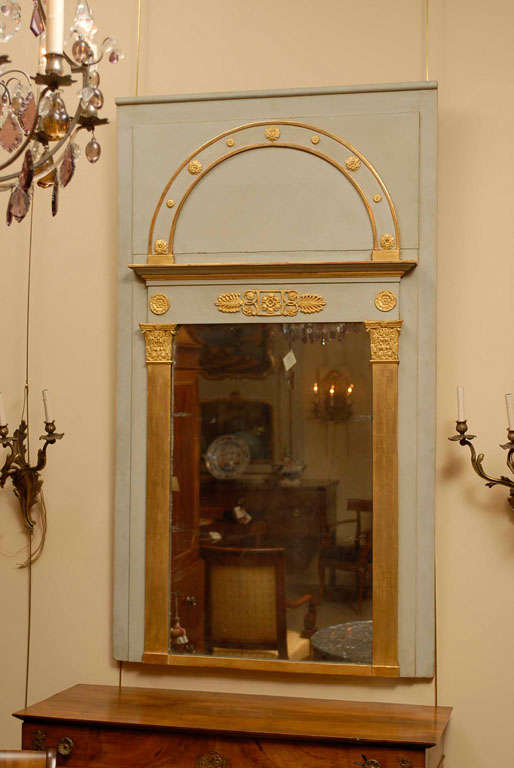 An Empire period blue/grey painted and parcel-gilt trumeau mirror. 

For many more fine antiques, please visit our online. 

William Word Fine Antiques: Atlanta's source for antique interiors since 1956.