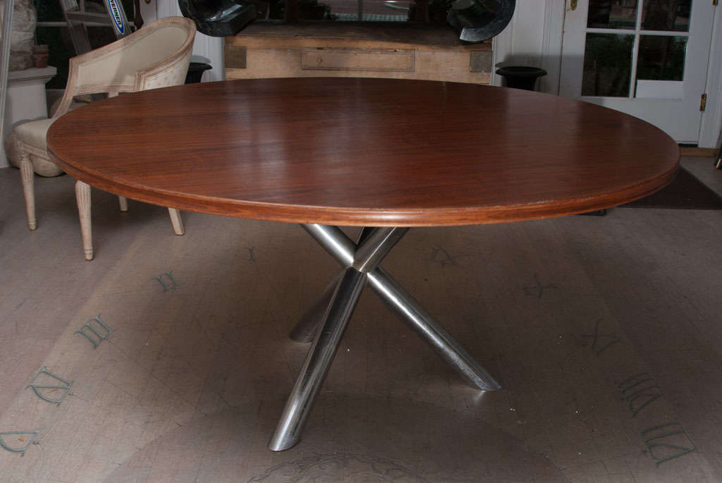 A Metal Base Gueridon Dining Table with a Mahogany Top.