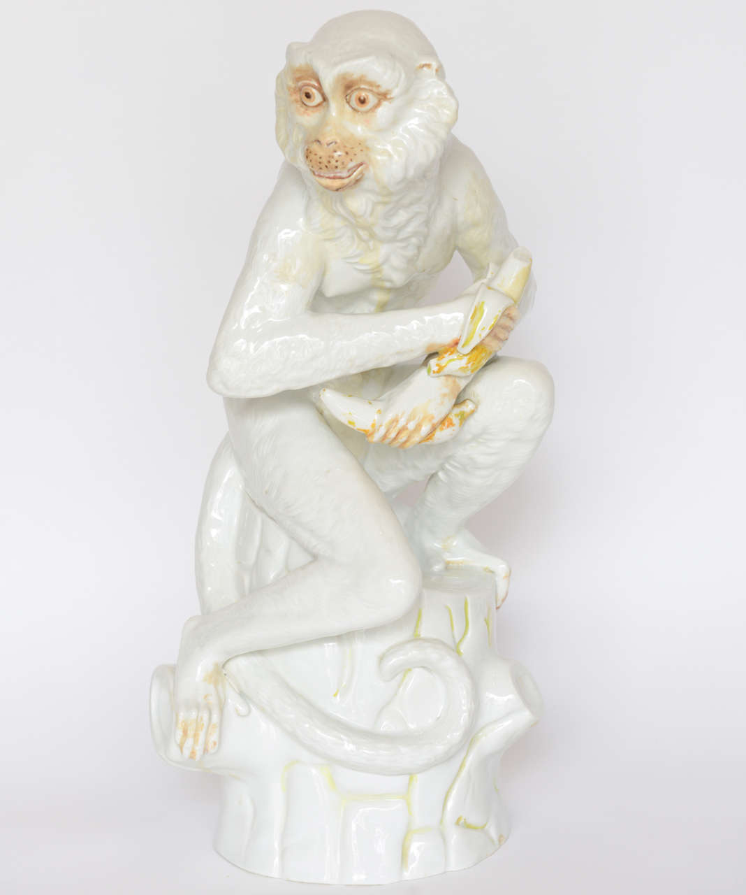 Seated Monkey Holding two Bananas bearing the signature
RPM and the # 6393.