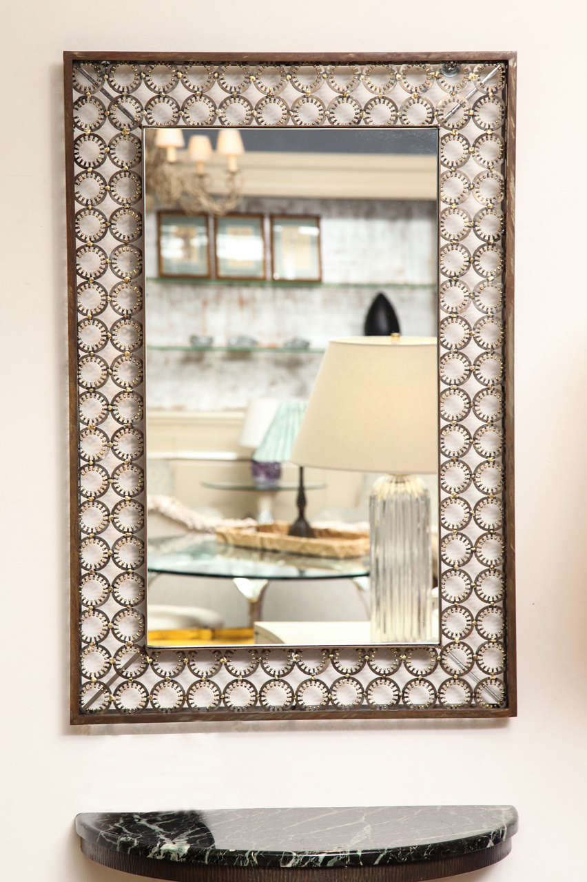 Marie Suri
The ovation mirror
Rectangular wall mirror with steel medallions and bronze decoration in a patinated steel frame. Custom inquires welcome.
Two frame options shown here:
mitered corners with two rows all the way around: 38.25