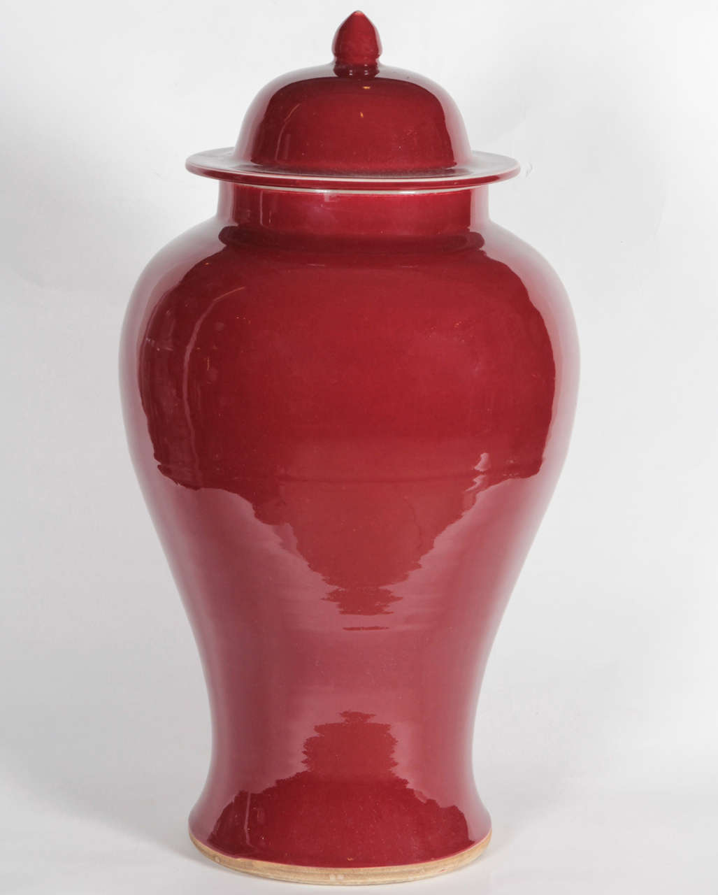 Par of monochrome ginger jar vases in oxblood.  Chinese; first half of 20th Century.