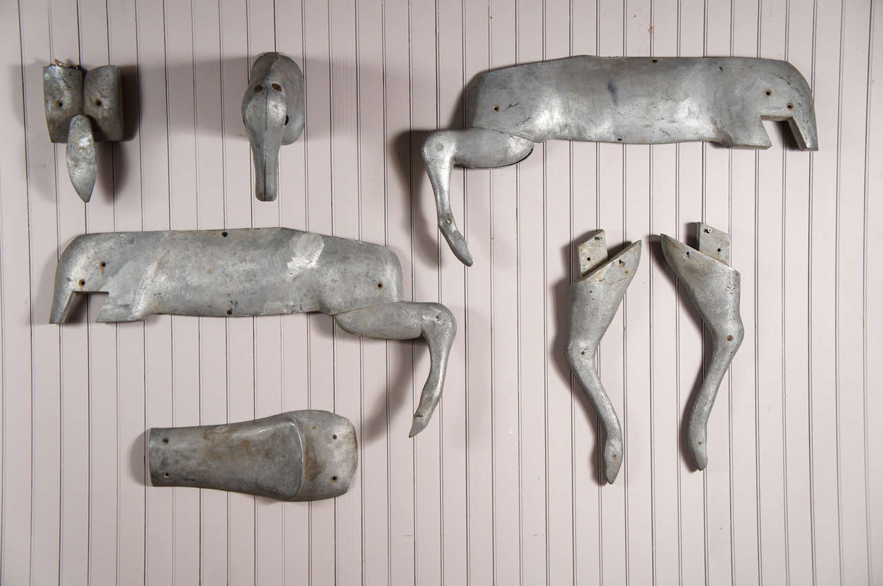 Seven cast aluminum body parts - 1930's - carousel deer - including left and right flank with back legs, pair front legs, head, saddle seat, tail - measurements are of one flank only.