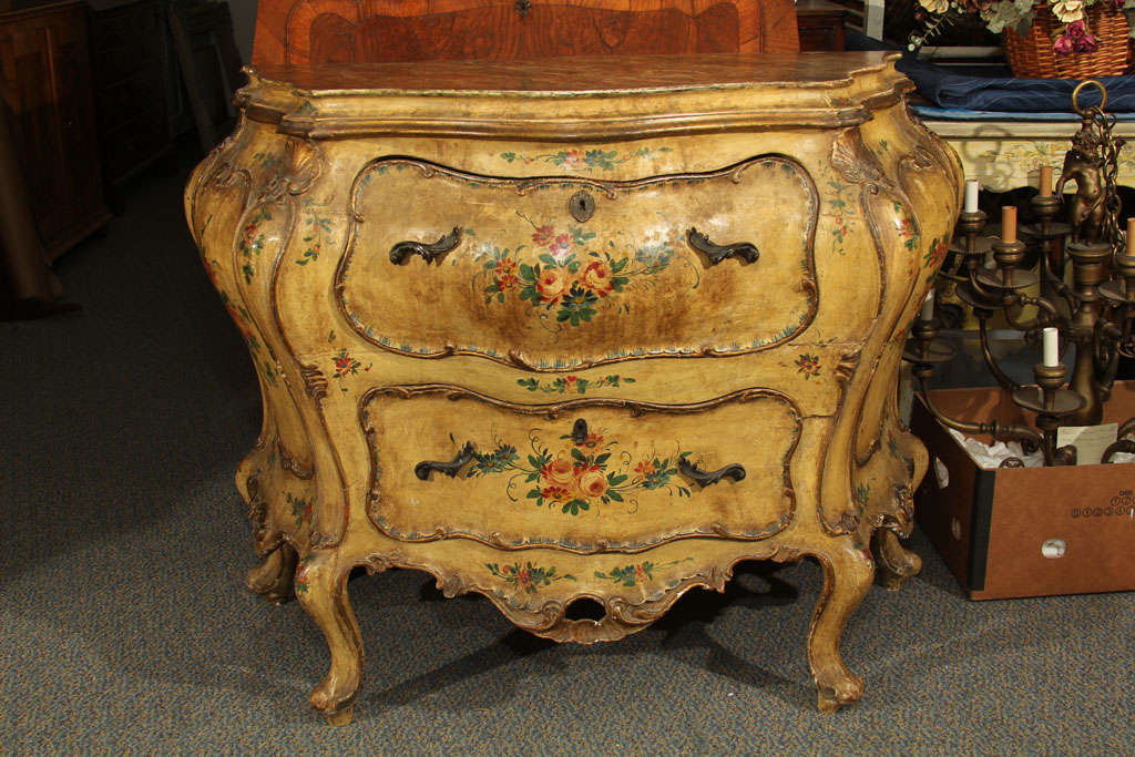 A good 18th century Italian(Venetian) painted and faux marble top commode with serpentine shape and original decoration