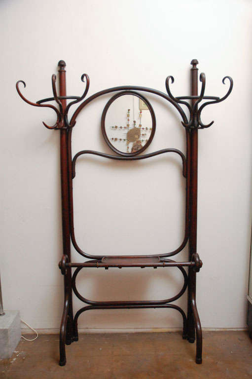 Nice bentwood work in this coat rack made by Thonet.