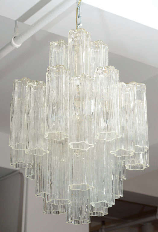 Venini chandelier for Camer Glass (No. 2895) made with clear tronchi (tree) shaped Murano crystal. The chandelier has a steel frame with multiple lights that hold up to 400 watts total. There's only been one owner of the chandelier and it's signed