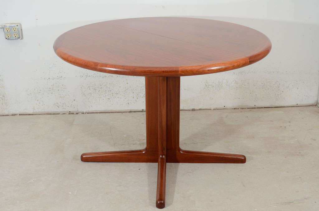 Beautiful teak wood danish dining table extend via central two leaves, superb banded edges and top quality work of construction  by Laurits M.Larsen.