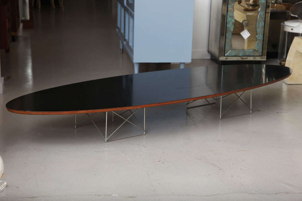 Classic Charles Eames surfboard coffee table in black with zinc base. The table is in original condition with original label.