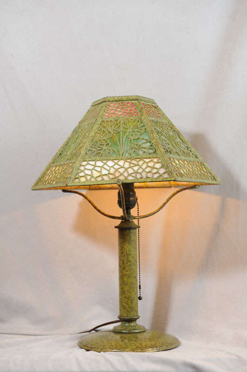 This is that great example of the beautiful work of the Bradley and Hubbard Company.  The lamp is signed under the base and has the very special factory frog-skin patina.  This patina normally is badly worn; this one is in super condition.  The