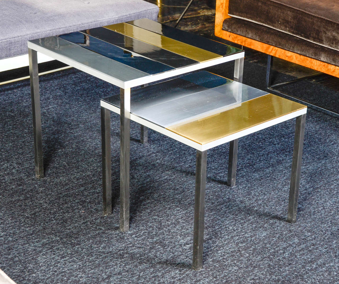 Unique pair of nested tables from the Florence Lopez collection by artist Thomas Lemut
Stainless steel, brass and aluminium.
Unique piece.
Very elegant and pure lines.

Large table dimension: 38cm x 38cm x 43cm.
Small table dimension: 43cm x