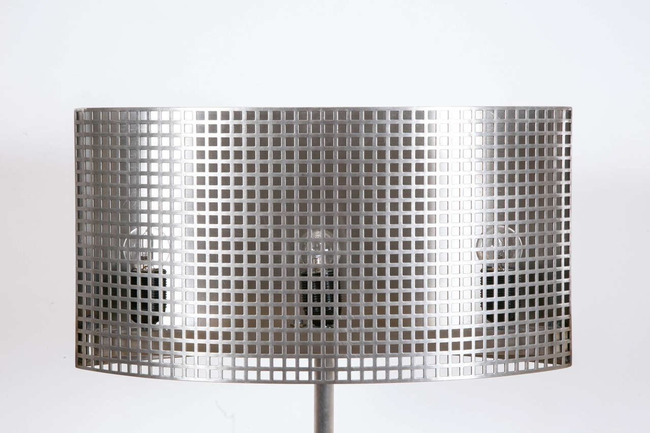 Original Inox steel floor lamp with grate shade, 2011, by René Broissand (1921).
Curved sculpted shaft.
Unique piece. Signed, dated.