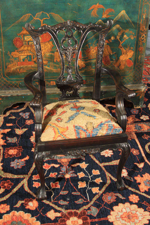 Adorable miniature chair upholstered in a piece of antique oriental carpet.  Chippendale style made in France.  Stained mahogany.  Ready for your favorite  Teddy bear or doll.  This would also make a great pin cushion!!