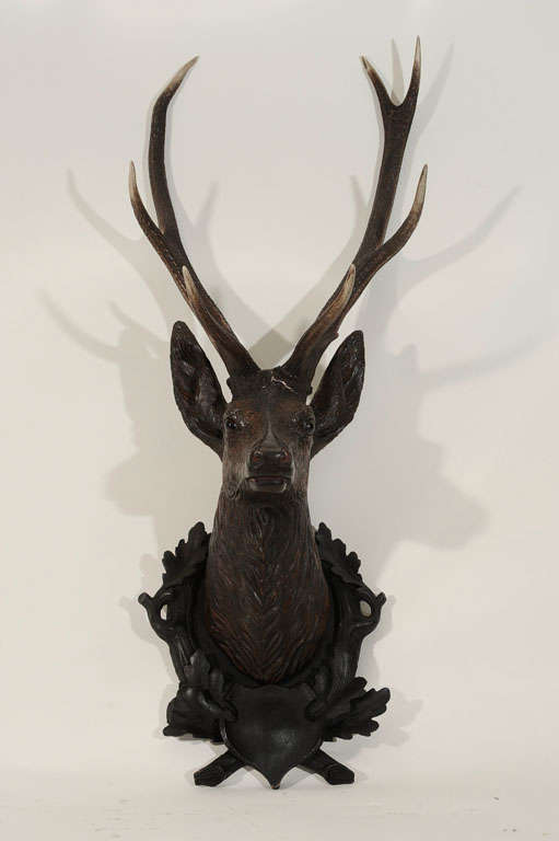 Carved deer head mounted on custom wood plaque