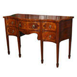 Antique English mahogany serpentine sideboard.