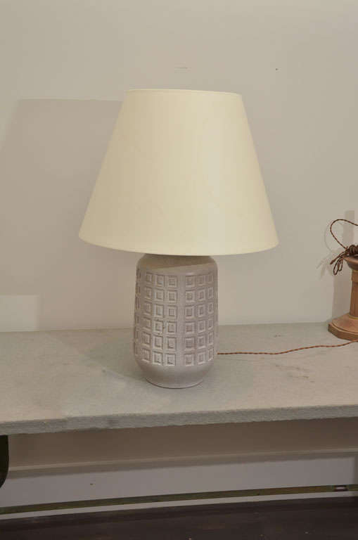 Pottery from West Germany that has been converted into a lamp with Bronze fittings. Shade Included.