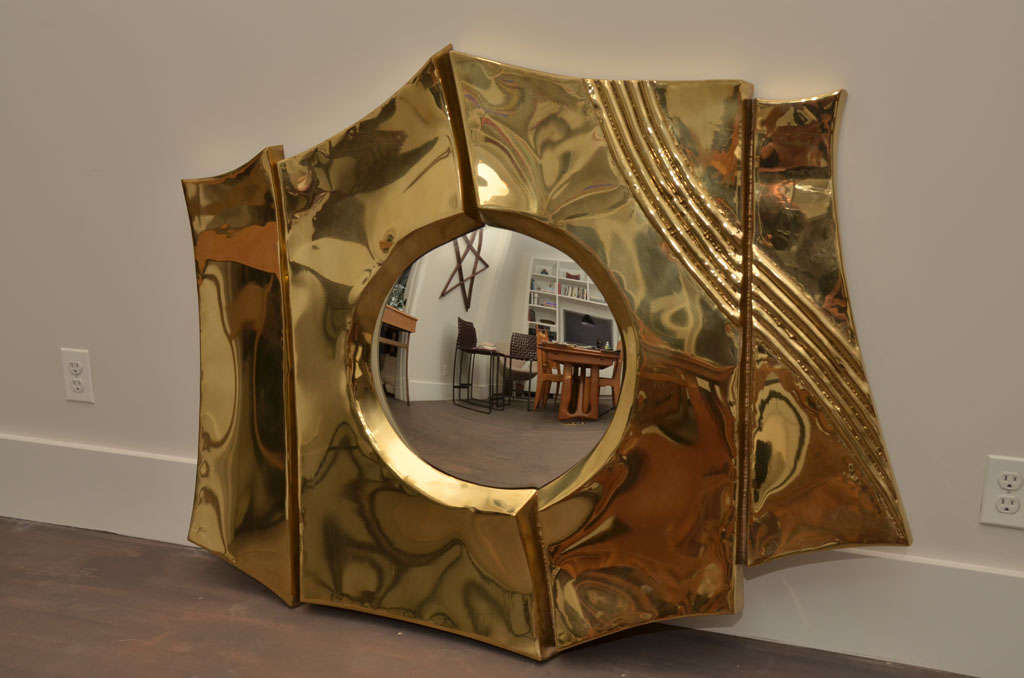 Brass mirror by Chervet. Signed.