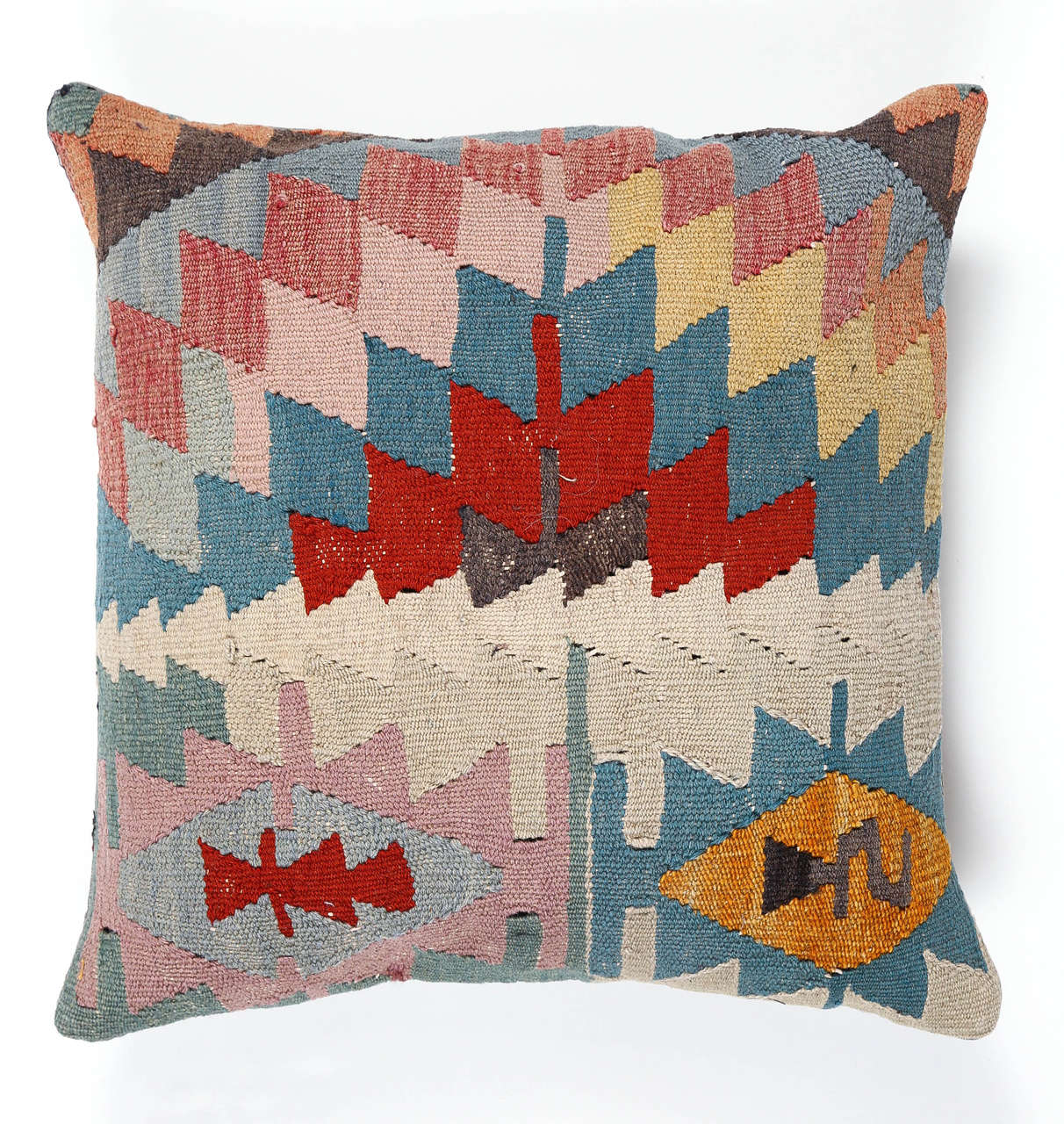 Vintage kilim pillow decorated with a geometric pattern. Solid pale blue fabric backing.
