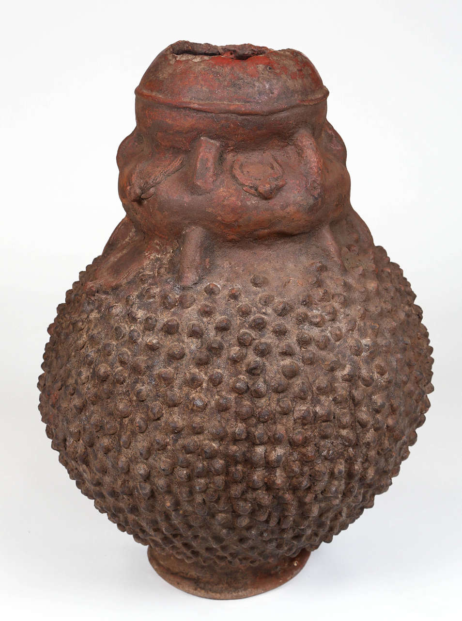 Volcanic clay Lobi pot with an arrangement of rounded points and decorative asymmetrical top. This pot was executed in the late 1920s.

The Lobi are an ethnic group that originated in what is today Ghana. Starting circa 1770 many of the Lobi