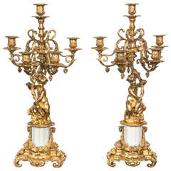 Pair of Gilt Bronze and White Marble Putti Candleabras
