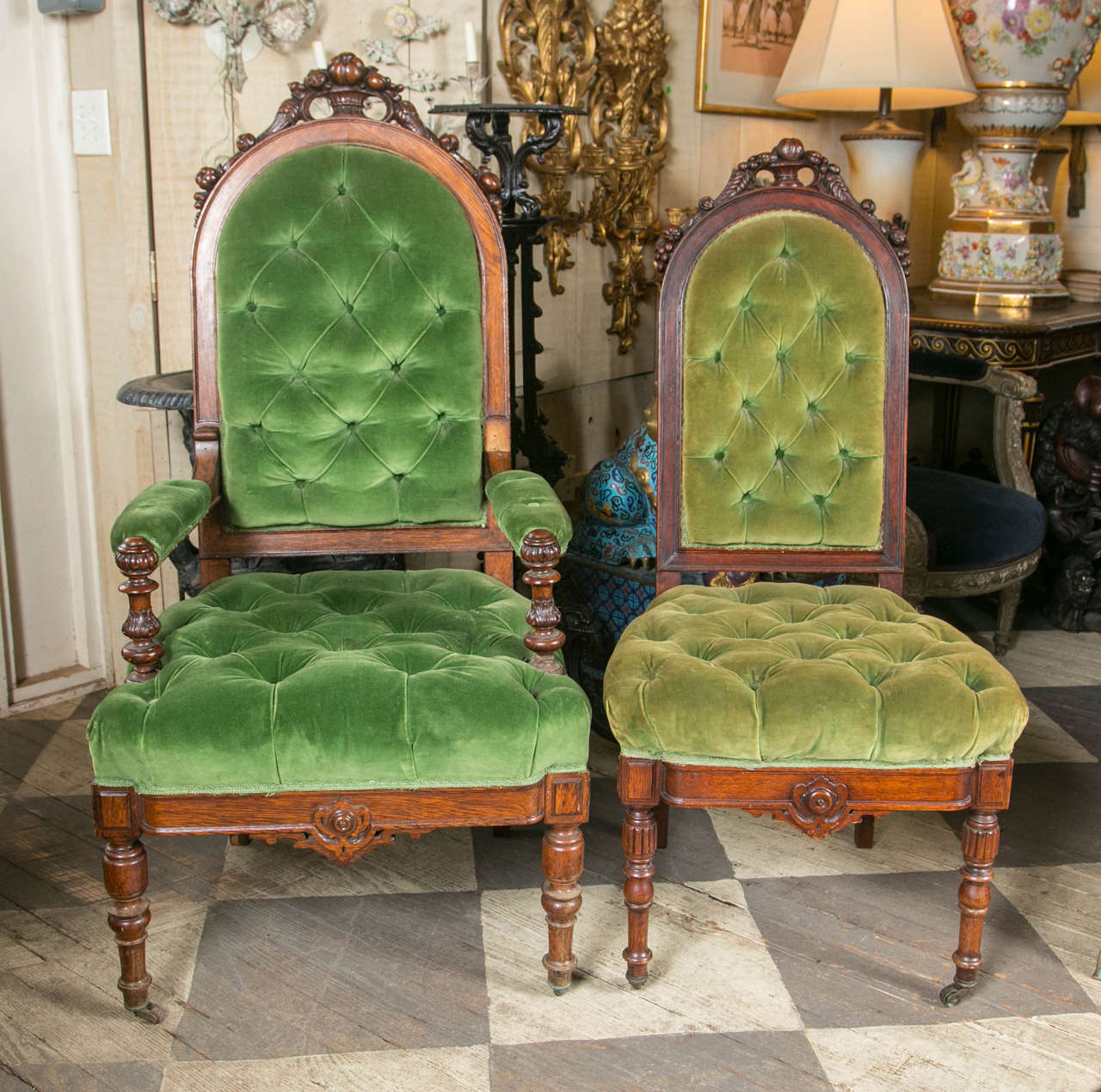 This set comprises two armchairs and six side chairs. The oak frames are hand-carved and decorated with nuts and fruits. The turned front legs have casters.
The side chairs are smaller in proportion to the arm chairs. The dimensions given are of the