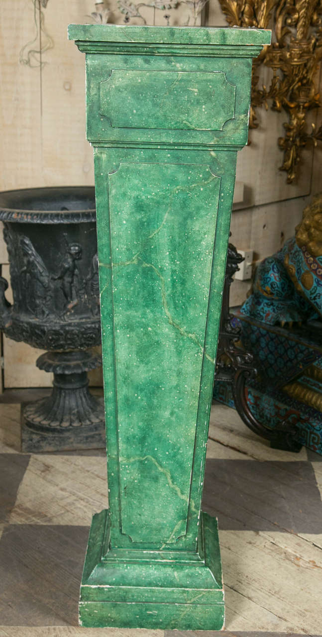 Pair of painted faux marble pedestals with  stepped base, tapered body and  stepped top.  Each side with added panels.