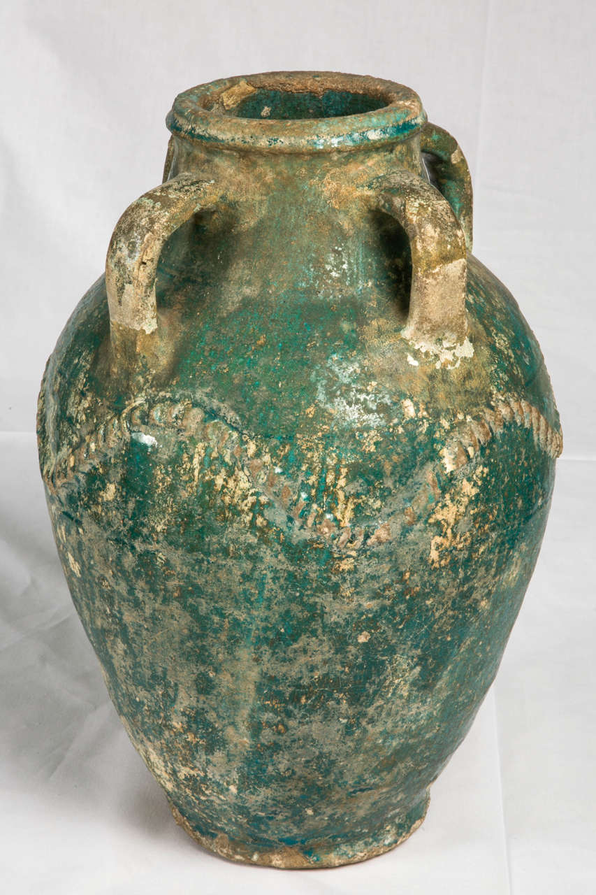 Earthenware with turquoise glaze. The glaze has decayed during burial to give the present blue-green iridescence.
very good condition, no breaks on the body only few chips.
Iraq or Syria, 8-10th century AD.