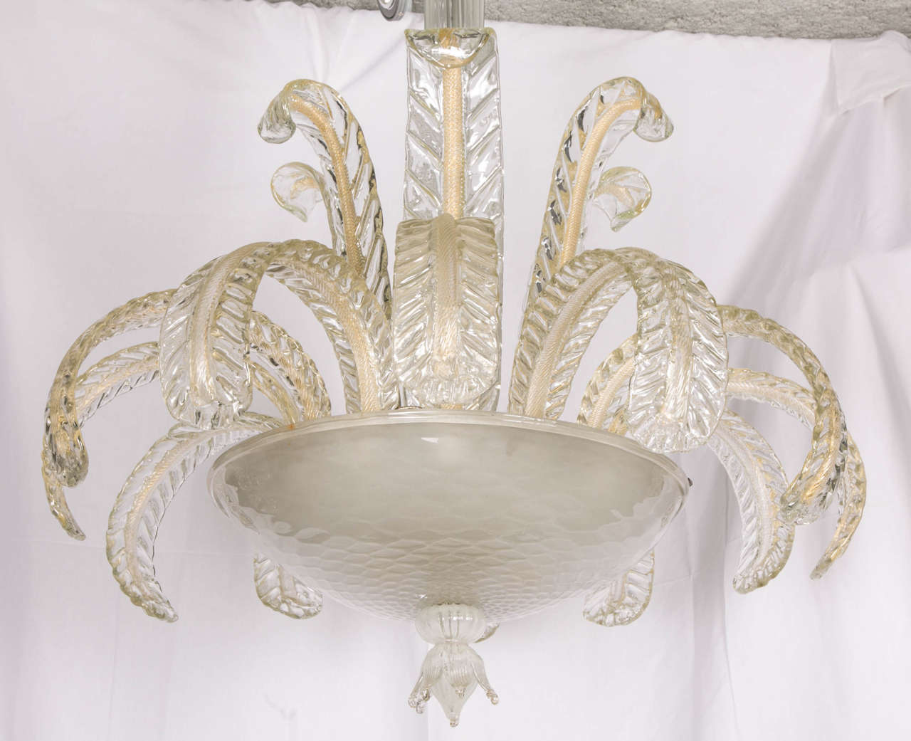 An impressive quality glass chandelier from Murano. Typical work of the 1940s-1950s with some small gold leaves elements inside the glass. Faceted glass large cup in depolish glass. The four bulbs are inside the cup. Photos of the inside are