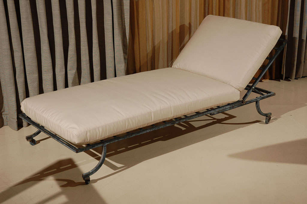 Pair of outdoor chaise lounges with new cream Sunbrella fabric.