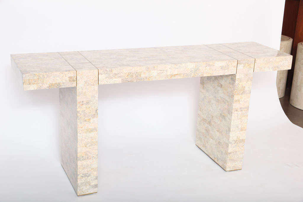 Sleek, low profile console in multi-tone tessellated stone, with brass inlay detail on top and base. Can be utilized as a console or writing desk. Brass tag underneath.