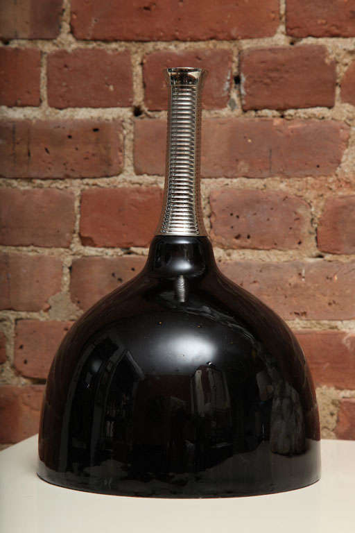Very contemporary centerpiece. The black base has a high gloss finish. Perfect to decorate by itself or as flower vase.