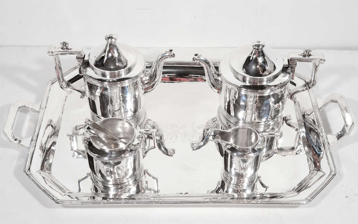 This incredible service is made of Heavy sterling silver. It includes a coffee pot, tea pot, sugar bowl, sugar tongs, creamer and tray. This was custom made in the Art Deco manner in Japan for a wealthy jewish family fleeing Hungary. I can't