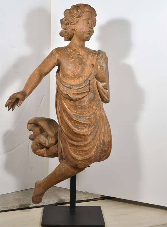 Carved wooden angel from Private Chapel in Provence. Wonderful detail in Angel's hair and draped dress. Figure is mounted on an iron stand.