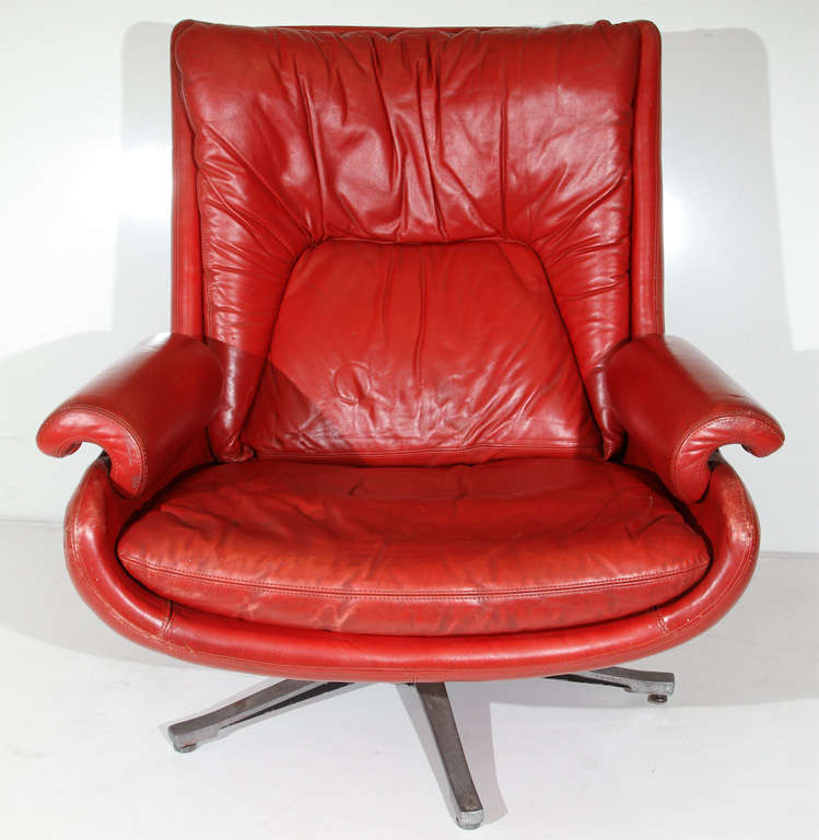 Paul Tuttle Apollo Lounge Chair for Strassle International.  Made in polyurethane, red leather lounge chair with steel stationary base. 


