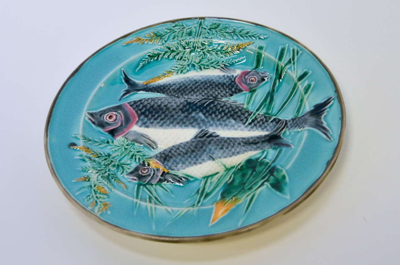 This is a beautiful Wedgwood plate in perfect condition without any chips, cracks, or hairline fractures.  The turquoise colors are typical for Wedgwood and make a lovely background for the three fish and ferns.  There is a clear marking of Wedgwood